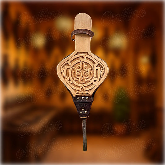 Handcrafted Moroccan bellows – front view of traditional fire blower in carved wood and leather, made in Marrakech