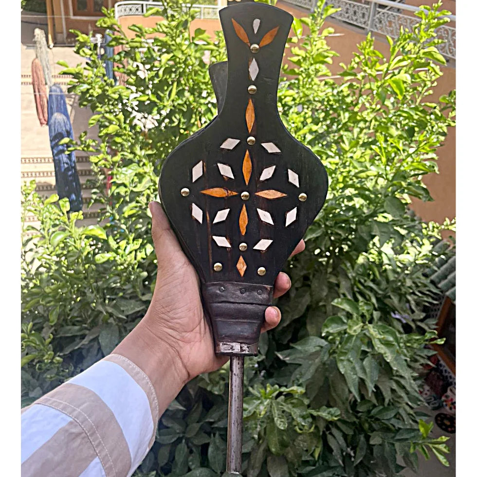 Moroccan bellows in black wood featuring intricate bone and henna-stained inlay with forged iron tip – artisan fireplace tool with oriental charm