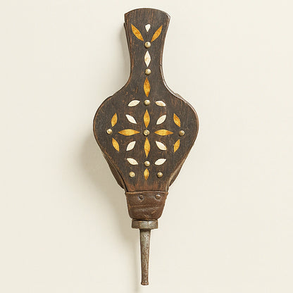 Handcrafted Moroccan fireplace bellows in dark wood with henna-stained bone and brass details, wall-mounted display