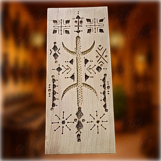 Front of Berber wooden wall amulet hand carved with Amazigh patterns
