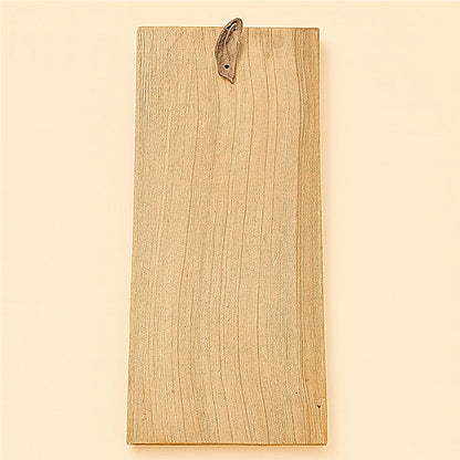 Back view of handcrafted Berber cedar wood amulet showing natural wood grain and leather hanging strap – Online Medina