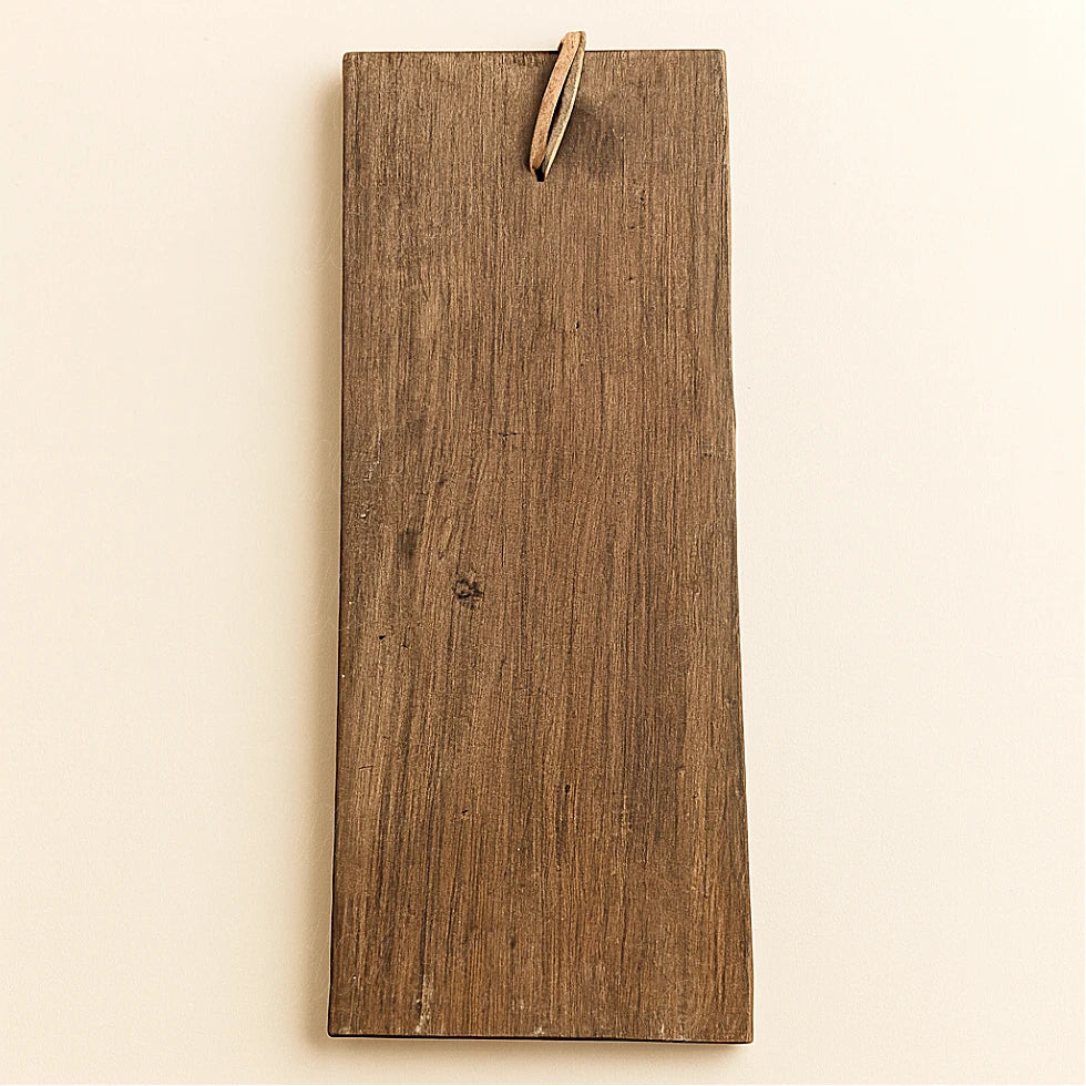 Back view of the Berber wooden amulet showing natural cedar grain and leather hanging loop, on a plain light background.