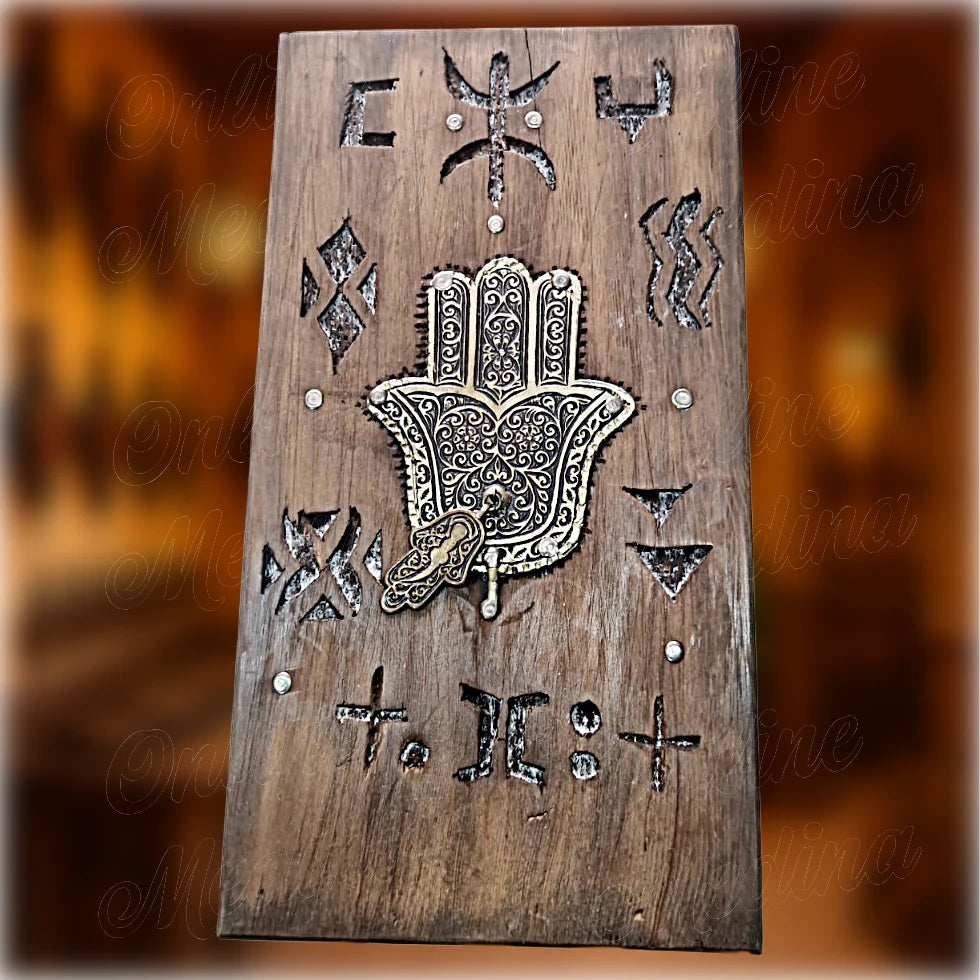Berber wooden wall amulet in cedar wood with engraved Amazigh motifs and central Hamsa hand symbol, traditional Moroccan wall decoration by Online Medina