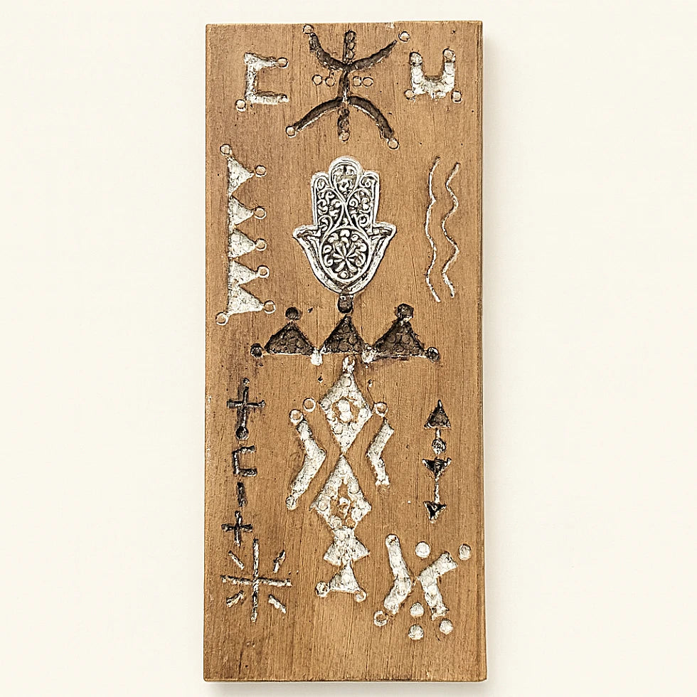 Light Berber wooden wall talisman with engraved Amazigh symbols and detailed silver Hamsa hand, handcrafted from natural cedar wood