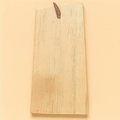 Back view of the same handcrafted Moroccan cedar wood wall amulet showing the natural wood grain and leather hanging strap on a beige background.