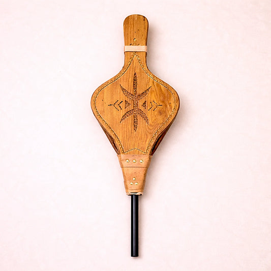 Handmade Moroccan wooden fire bellows featuring traditional Amazigh geometric carving