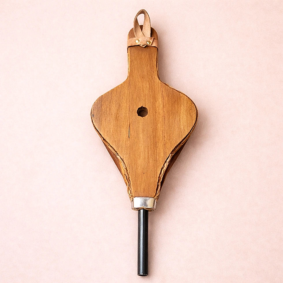 Back view of traditional Moroccan fire bellows showing handcrafted wood and leather details