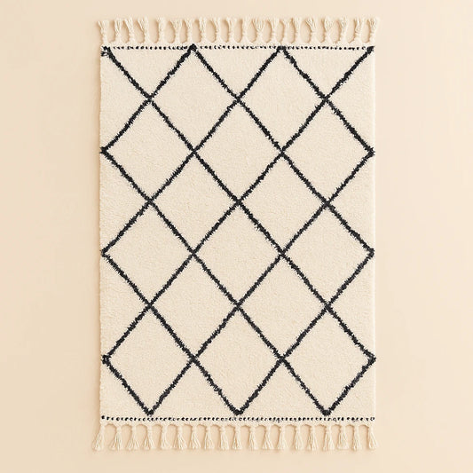Handwoven Moroccan Beni Ourain rug with black diamond pattern on cream wool background, crafted by artisans for Online Medina.