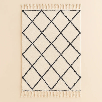 Handwoven Moroccan Beni Ourain rug with black diamond pattern on cream wool background, crafted by artisans for Online Medina.