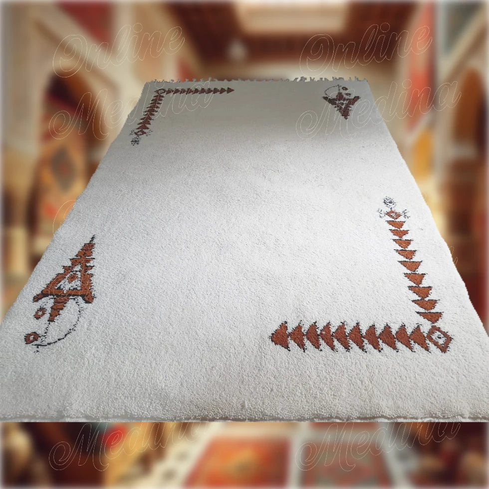 White wool Moroccan Khelala rug with brown Berber motifs, handcrafted for a touch of traditional interior elegance.