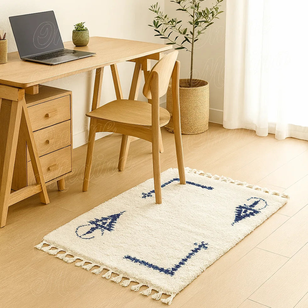 Khelala Moroccan wool rug with blue patterns, soft natural light and minimalist interior
