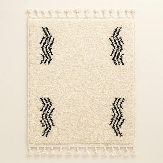 Cream Berber wool rug with four black zigzag wave motifs and fringes, handmade by Moroccan artisans