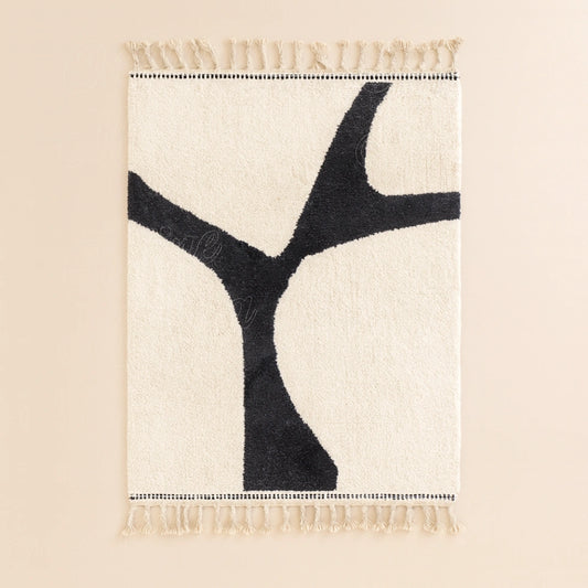 Handwoven Moroccan modern wool rug, minimalist black pattern on white background with traditional fringes on both sides.