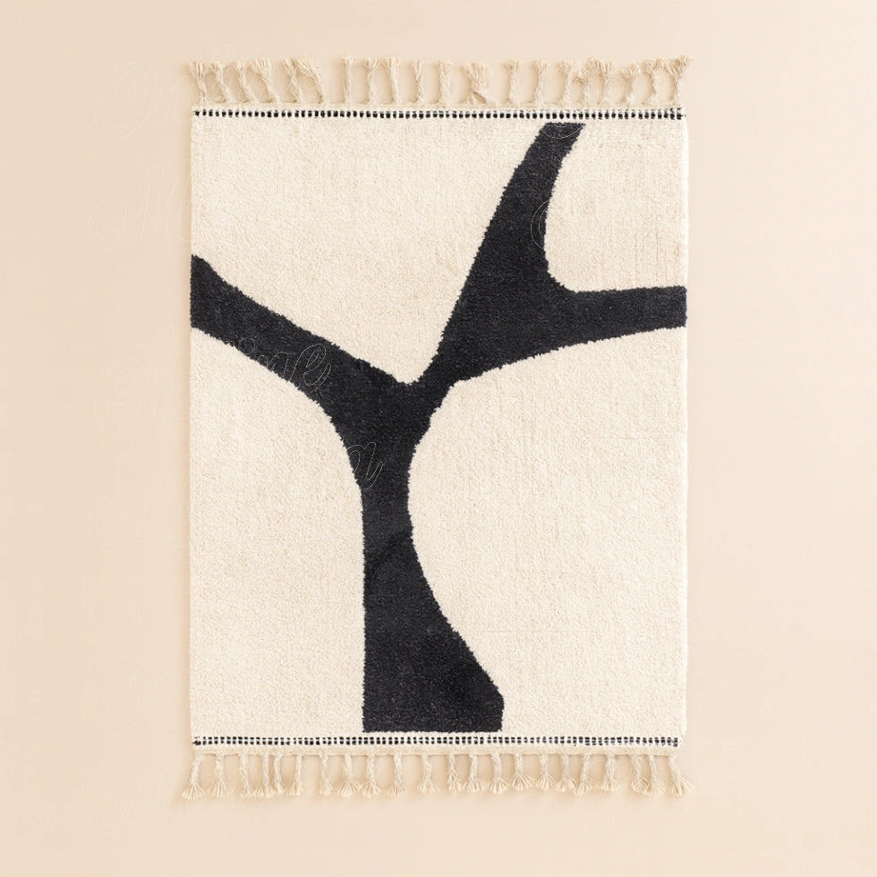 Handwoven Moroccan modern wool rug, minimalist black pattern on white background with traditional fringes on both sides.