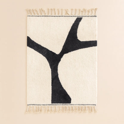 Handwoven Moroccan modern wool rug, minimalist black pattern on white background with traditional fringes on both sides.