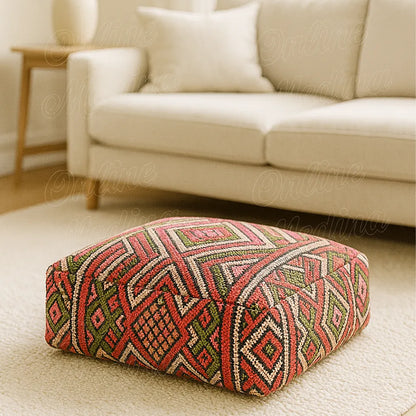 Traditional Moroccan pouf in red and green handwoven Hanbel fabric