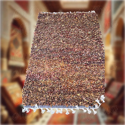 Detailed view of weaving and finishing of a Boucharouite rug made from Moroccan leather — handcrafted traditional decor.