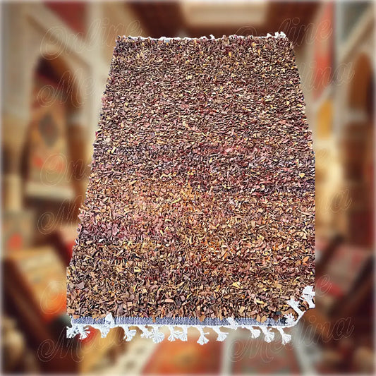 Detailed view of weaving and finishing of a Boucharouite rug made from Moroccan leather — handcrafted traditional decor.